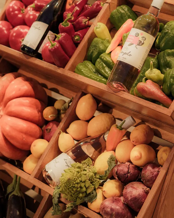 Fresh produce and d'angelo branded wine bottles